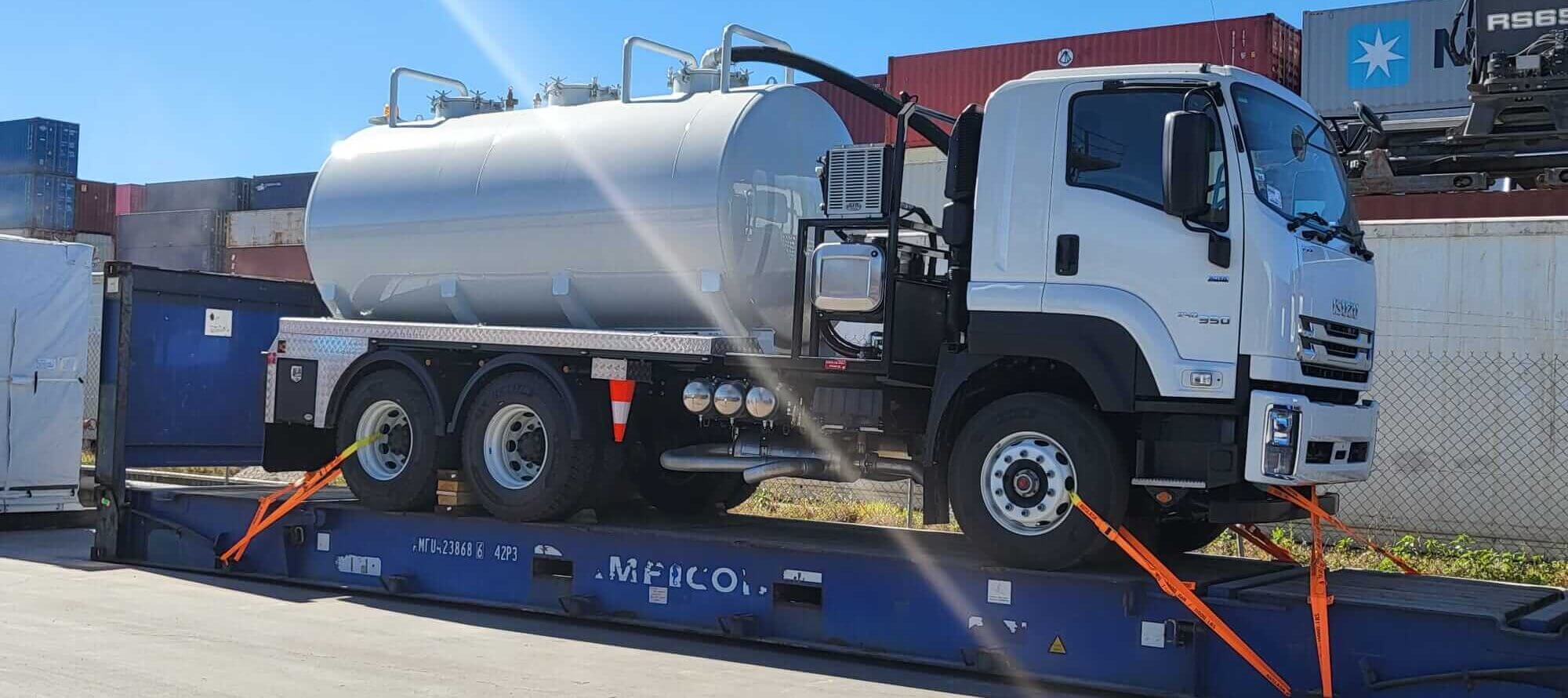 Truck secured to flat rack with Cargo Restraint Systems' Cargo Lashing